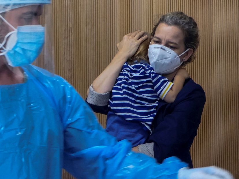 A mother and child await treatment at a Covid pediatric unit in Palma de Mallorca in a file photo from October 2020.