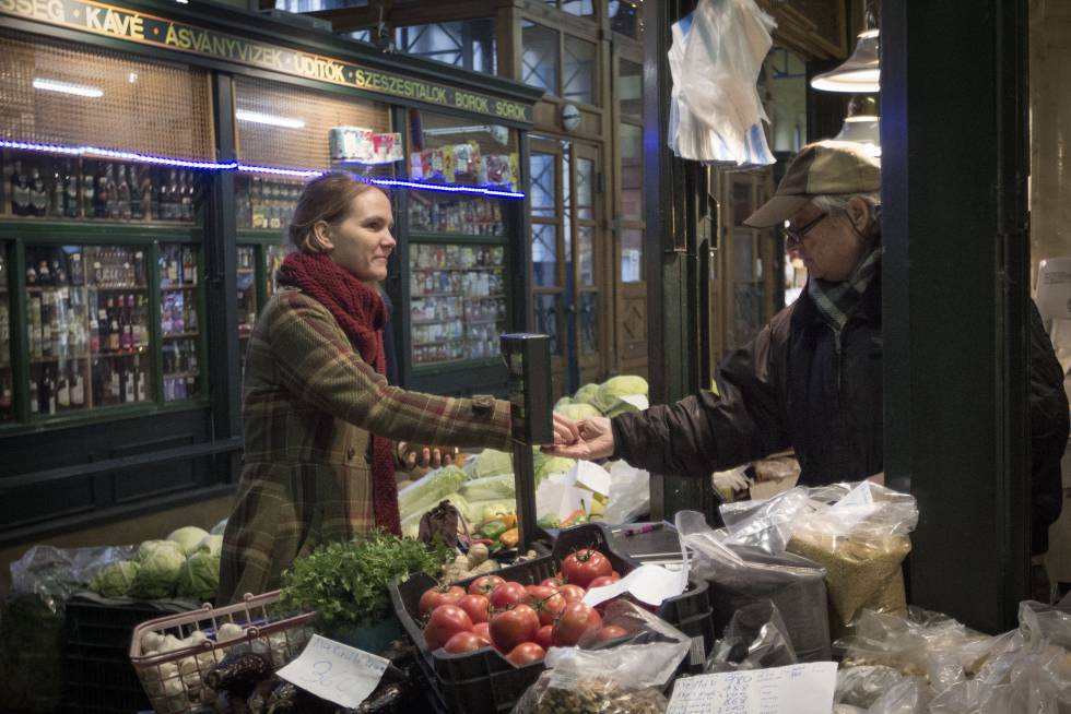 Sarolta Molnar buys groceries at Rákóczi Market in Budapest.