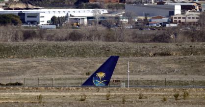 The tail of the Saudi Airlines flight on a runway at Terminal 4.