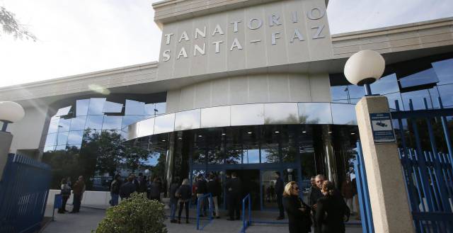 Family and friends pay their respects.