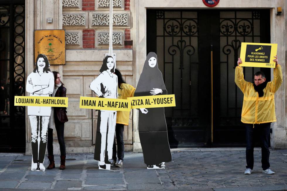 Amnesty International activists protest against arrests of Saudi feminists in March before the Saudi Arabian Embassy in Paris.
