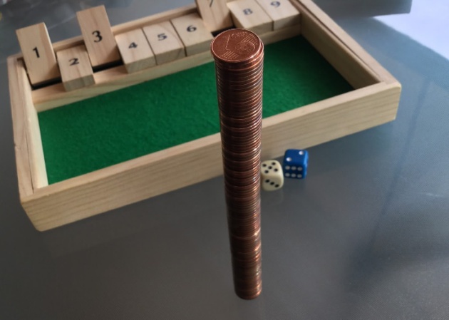 El problema clásico de las 100 monedas y las 10 caras